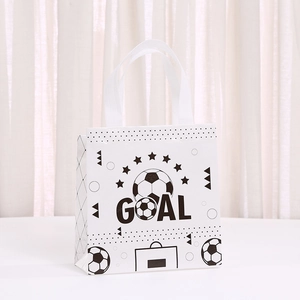 Detail of non-woven soccer gift bag with black GOAL print and gusseted side for extra space