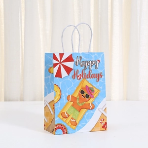 Detail of blue kraft paper gift bag featuring a gingerbread man on a summer holiday print