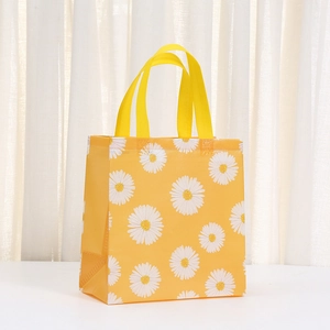 Vibrant yellow non-woven shopping bag featuring a large white daisy flower print design