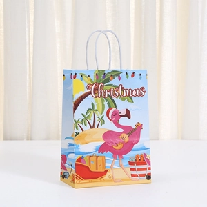 Detail of Christmas paper gift bag with tropical flamingo print and white rope handle