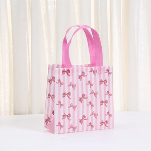 Pink and white striped non-woven gift bag with sweet bow print and pink handles