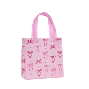 Pink waterproof non-woven gift bag with bow print and hearts for shopping and birthdays