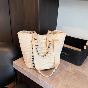Handwoven straw tote bag with Summer Beauty straps for beach vacations or daily use