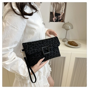 Detail of grey leopard print handbag featuring matte square buckle and velvet texture