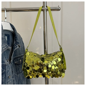 Close-up of lime green sequin shoulder bag with large round metallic fish scale texture