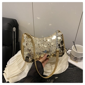 Detailed view of the gold sequin shoulder bag with metallic chain and leather strap
