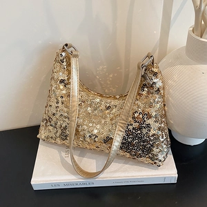 Elegant gold sequin hobo bag with metallic finish shown on a minimalist white backdrop