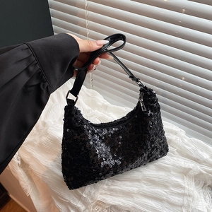 Elegant black sequin hobo bag with silver buckles for a glamorous evening party look