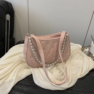 Quilted light pink underarm bag with elegant pearl chain and bow embroidery details