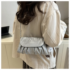 Silver textured crossbody bag with metallic chain strap and Fashion & Bags print logo