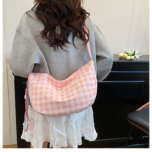 Pink and white gingham crescent bag with heart and bear embroidery on shoulder