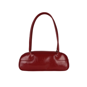 Minimalist deep red leather baguette bag with long handle in retro bowling style