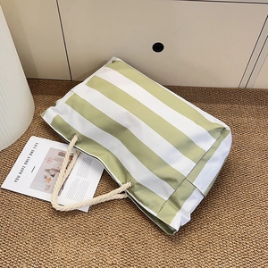 Large green striped beach tote bag with cotton rope handles for outdoor travel