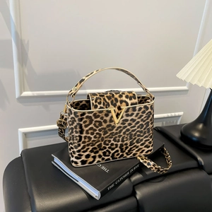 Chic leopard print box handbag with golden V buckle and adjustable shoulder strap