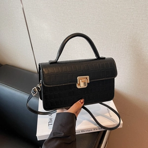 Chic black crocodile embossed square handbag with golden lock and detachable strap