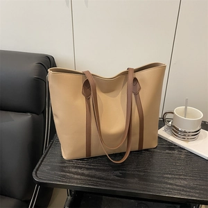 Large beige tote bag with brown straps, minimalist faux leather shoulder bag for daily work