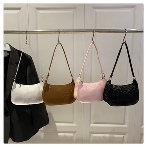 Collection of chic snake pattern underarm bags in white, camel, pink, and black colors