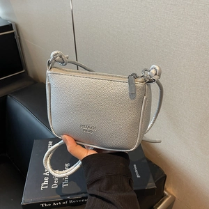 Silver metallic crossbody mini bag with litchi texture and sleek shoulder strap