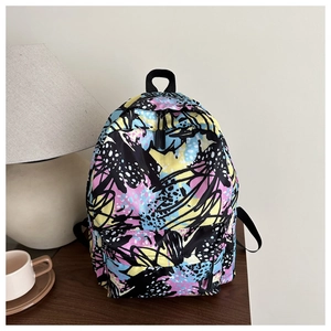 Macro shot of abstract graffiti print nylon backpack with reinforced top handle and zipper