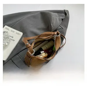 Interior view of brown suede crescent bag showing large capacity for cosmetics