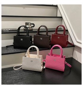 Detailed macro shot of luxury crocodile embossed mini handbags in five vibrant colors