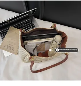 Detail view of large interior capacity for woven tote bag holding daily essentials