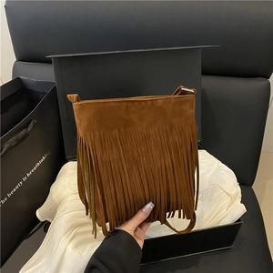 Vintage caramel brown suede shoulder bag with long bohemian tassels and crossbody strap