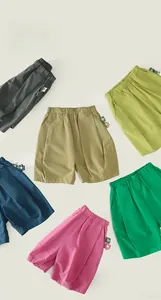 Flat lay of colorful kids' breathable sports shorts with elastic waist and side labels
