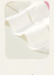 Detail shot of white cotton tee showing precision overlock stitching and high quality fabric