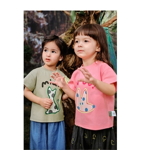Outdoor lifestyle shot of kids' cotton summer t-shirt set with cute cartoon cat prints