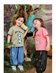 Detailed close-up of kids' summer cotton sets with cartoon cat and rabbit prints