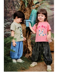Outdoor shot of kids casual sets featuring cartoon print t-shirts and joggers