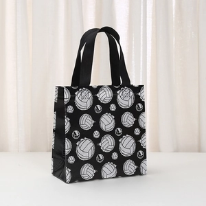 Detail view of the volleyball print on durable black non-woven tote bag with sturdy handles