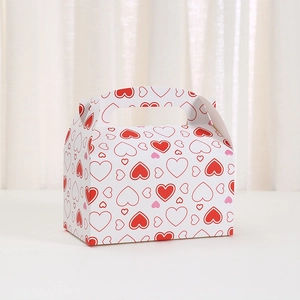 White cardboard gift box with pink heart patterns and handle for Valentine's Day favors