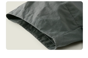 Detail of dark gray shorts showing premium cotton fabric and double-needle stitching