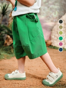 Kids loose cotton linen shorts in vibrant green with elastic waist for summer wear