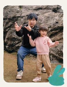 Family matching crewneck sweatshirts with heart detail in an outdoor setting
