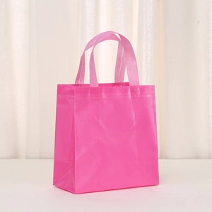 Rose pink non-woven gift bag with cross texture and reinforced handles for shopping