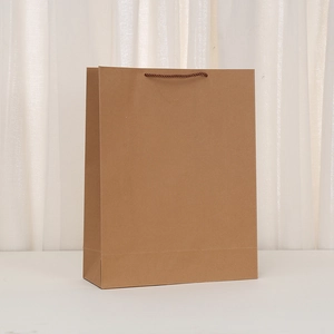 Vertical brown kraft paper shopping bag with woven rope handles and smooth finish