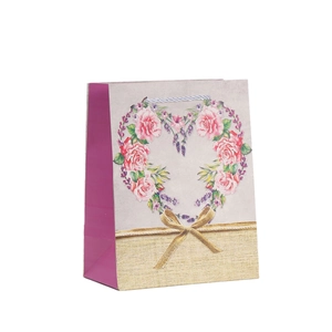 Lavender floral kraft paper gift bag with heart-shaped flower wreath and golden bow design
