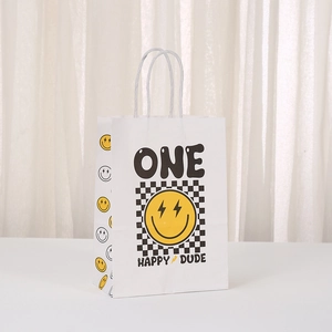 White paper gift bag with yellow smiley face, ONE HAPPY DUDE text and checkered pattern