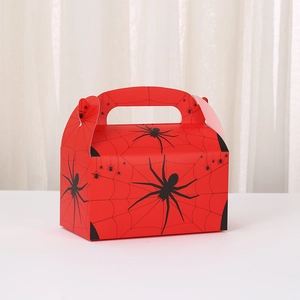 Detail of red Spider-Man themed party gift box with spider web patterns and top handle