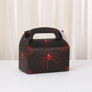 Detail of Spiderman style gift box with red spider web print and handle