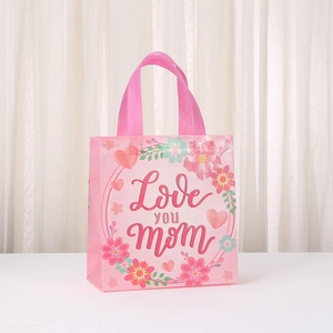 Pink Mother's Day non-woven gift bag with Love you mom text and floral heart prints