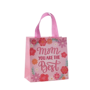 Pink non-woven Mother's Day gift bag with floral prints and Best Mom message