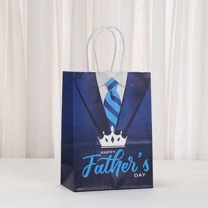 Father's Day gift bag with blue suit design, crown pattern, and white rope handles