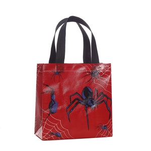 Halloween red non-woven gift bag with bold black spider and white cobweb prints