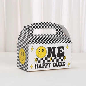 Yellow smiley face gift box with black and white checkerboard pattern and handle