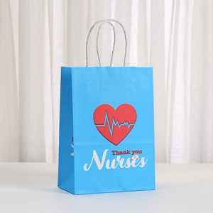 Close-up of blue paper gift bag with 'Thank you Nurses' text and heartbeat design