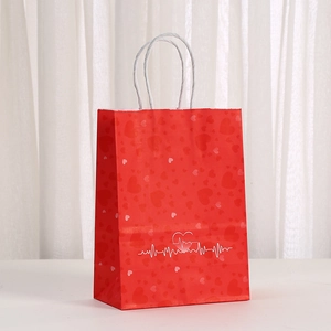 Red paper gift bag with heart pattern and white EKG line for Nurse Day celebration